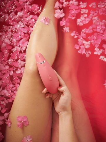 person with pink hearts on her lap
